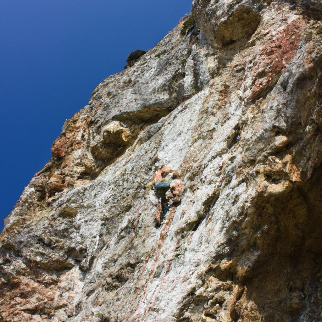 Person rock climbing on cliff